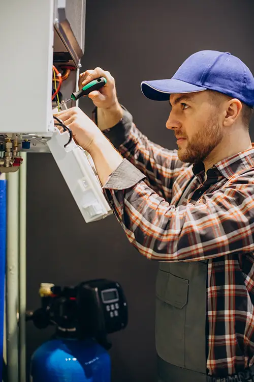 Man repairing HVAC unit