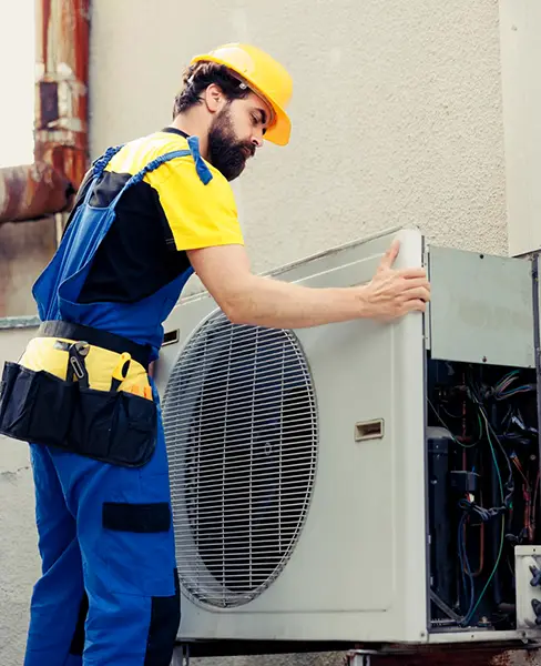 Man repairing AC unit